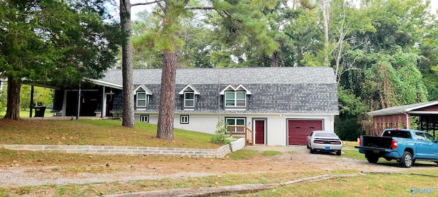 view of front of house featuring a garage and a front lawn