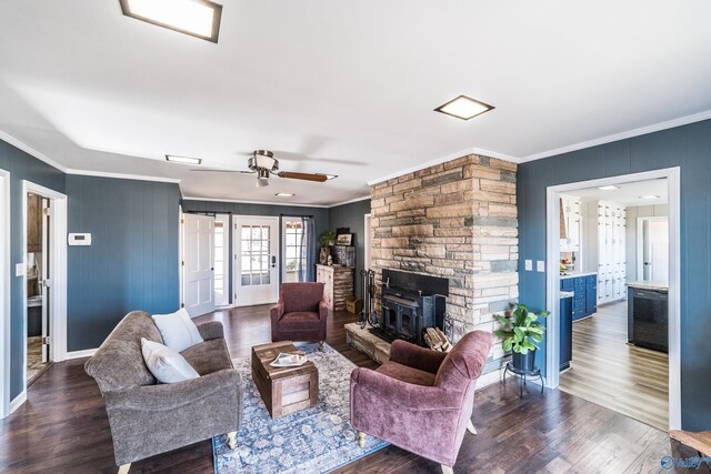 living room featuring ornamental molding and dark wood-type flooring