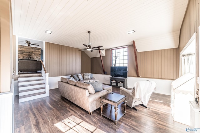 living room featuring wood-type flooring, wood ceiling, and ceiling fan