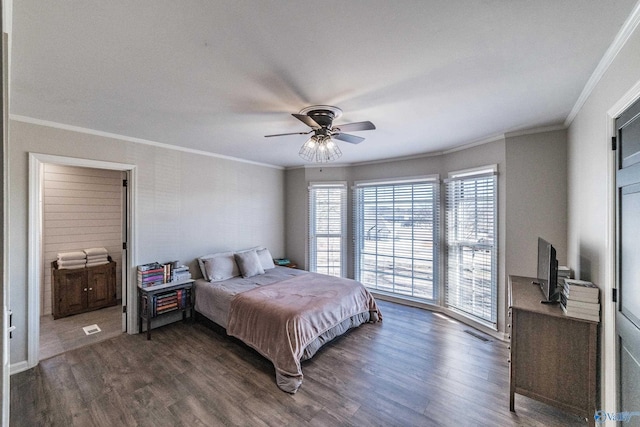 bedroom with dark wood-type flooring, ceiling fan, and crown molding