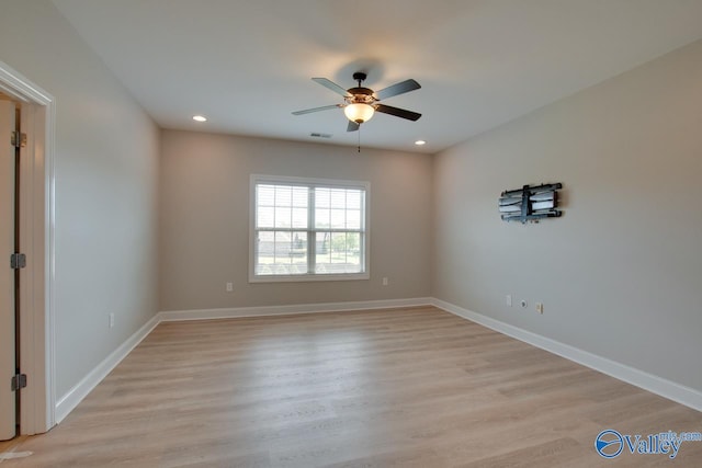 unfurnished room featuring ceiling fan and light hardwood / wood-style flooring