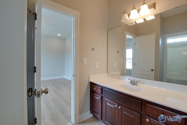 bathroom featuring vanity and a wealth of natural light