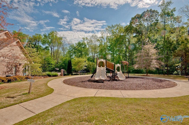 view of jungle gym with a lawn