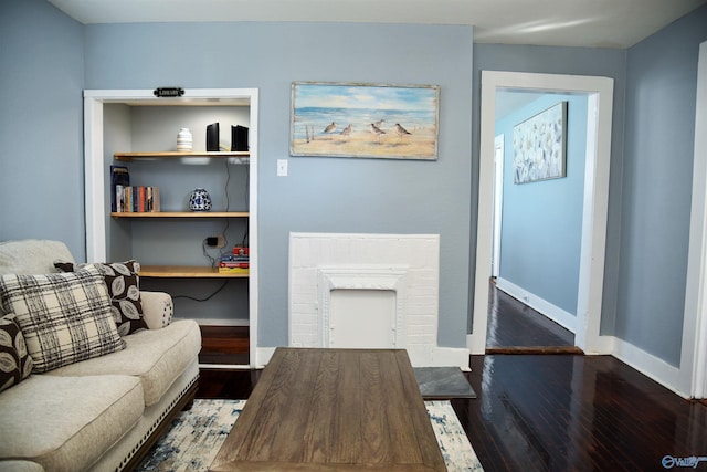 living room featuring dark wood-type flooring