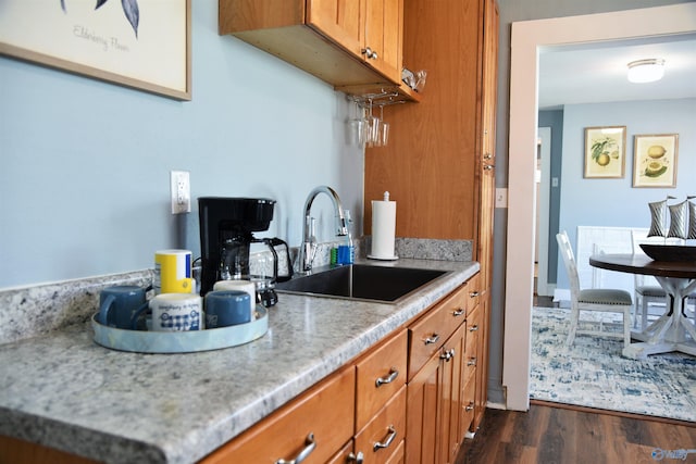 kitchen featuring dark hardwood / wood-style flooring and sink