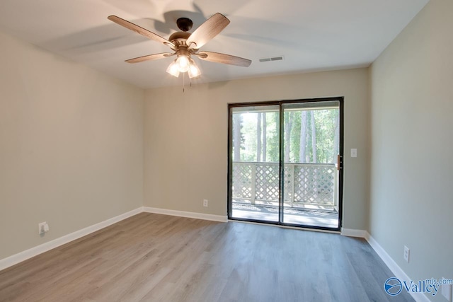 spare room featuring light hardwood / wood-style flooring and ceiling fan