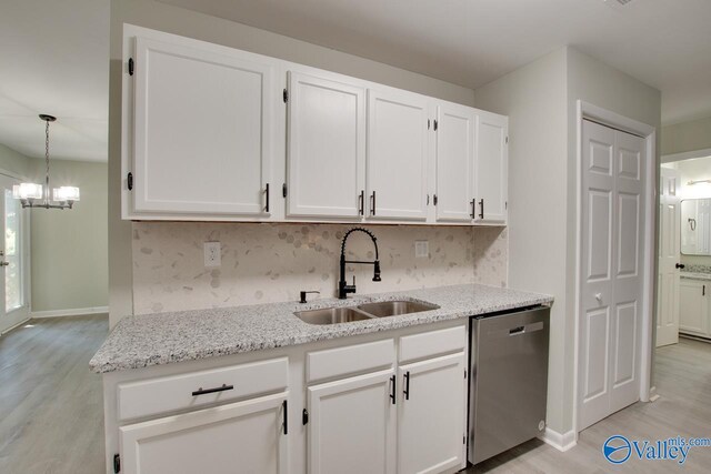 kitchen featuring sink, stainless steel dishwasher, and light wood-type flooring