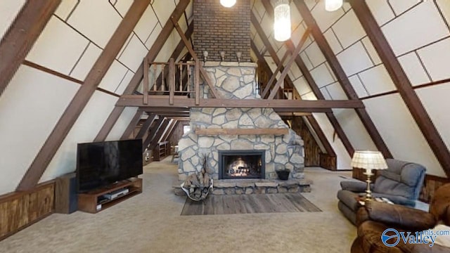 living room featuring beam ceiling, high vaulted ceiling, light colored carpet, and a fireplace