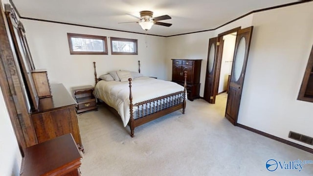 bedroom featuring light colored carpet, crown molding, and ceiling fan