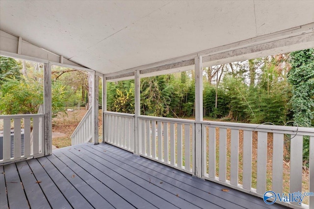 exterior space with lofted ceiling and a healthy amount of sunlight