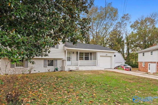 tri-level home with a garage and a front yard