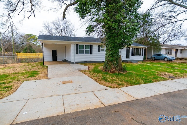 ranch-style home with a carport and a front lawn