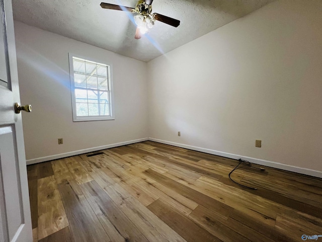 781 Lloyd Rd, Wellington, AL 36279 - unfurnished room featuring visible vents, hardwood / wood-style floors, baseboards, ceiling fan, and a textured ceiling
