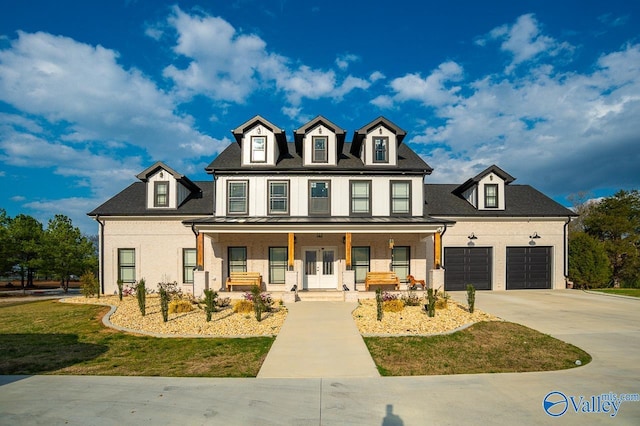 view of front of home featuring a garage and covered porch