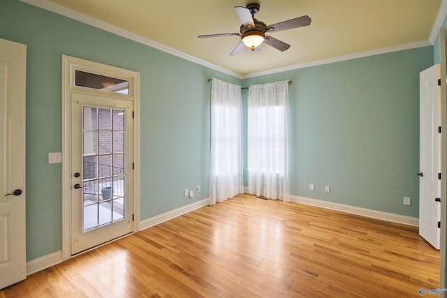 spare room with crown molding, ceiling fan, and light hardwood / wood-style flooring