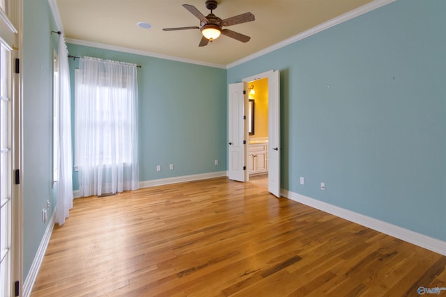 unfurnished room featuring ceiling fan, ornamental molding, and light hardwood / wood-style flooring