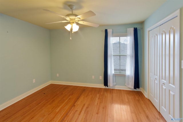 unfurnished room with ceiling fan and light wood-type flooring