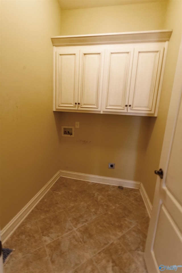 washroom featuring cabinets, hookup for an electric dryer, and hookup for a washing machine