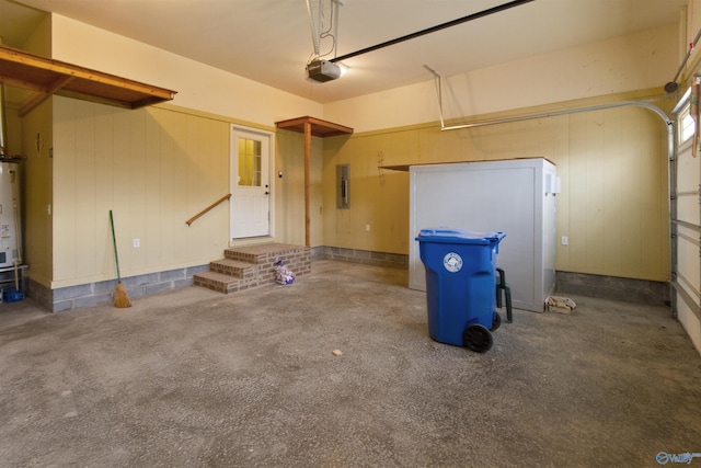 garage featuring a garage door opener, electric panel, and water heater