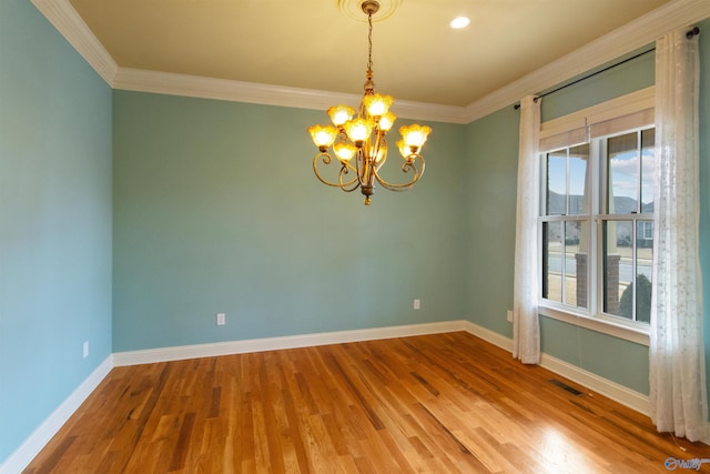 unfurnished room featuring hardwood / wood-style flooring, plenty of natural light, and ornamental molding