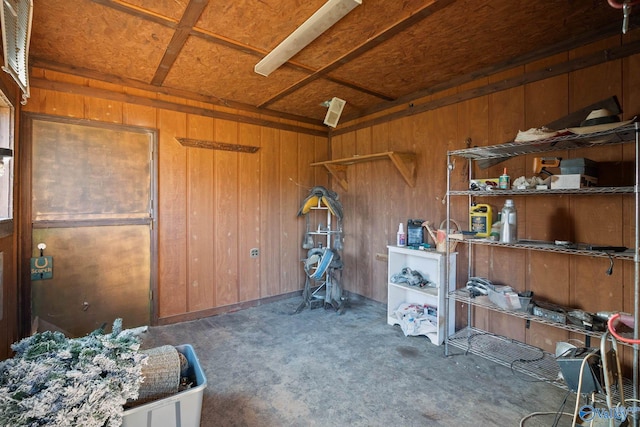 misc room featuring wooden walls