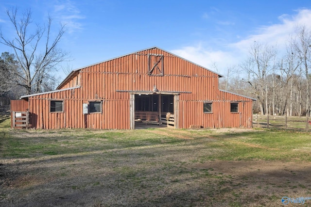 view of barn with fence