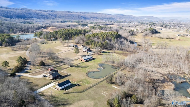 drone / aerial view featuring a water and mountain view