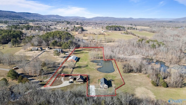 birds eye view of property featuring a rural view and a water and mountain view