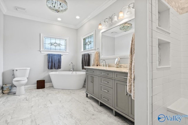 bathroom with vanity, marble finish floor, a soaking tub, toilet, and ornamental molding