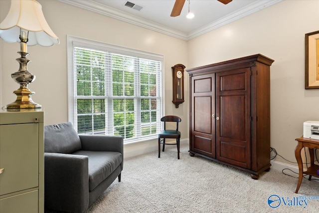 sitting room featuring visible vents, light carpet, baseboards, and ornamental molding