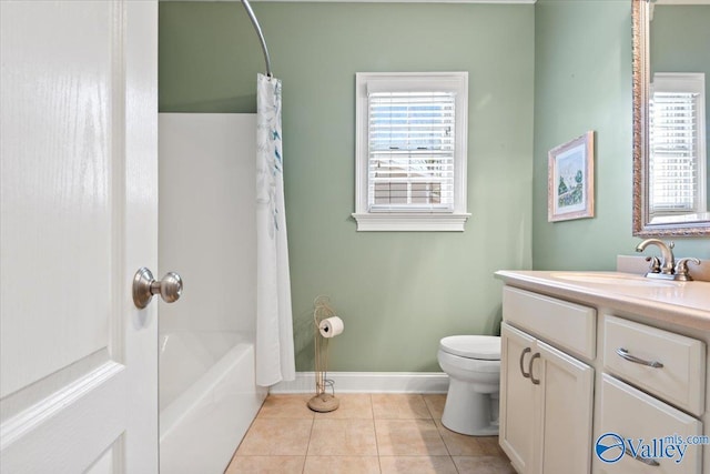 bathroom with tile patterned floors, vanity, shower / tub combo with curtain, baseboards, and toilet