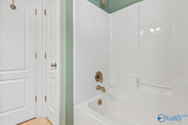 full bath featuring tile patterned flooring