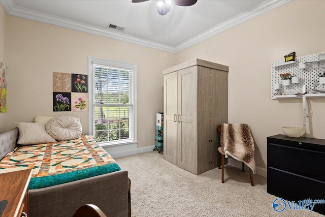 bedroom with baseboards, visible vents, crown molding, and light colored carpet