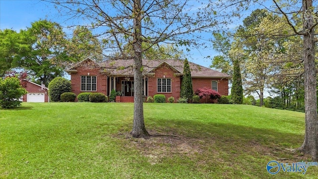 view of front of property featuring brick siding and a front yard