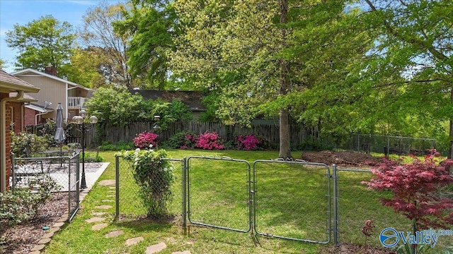 view of yard featuring a gate and fence