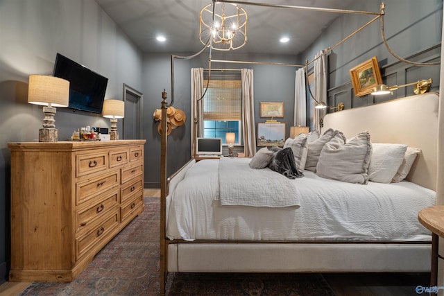 bedroom featuring a notable chandelier