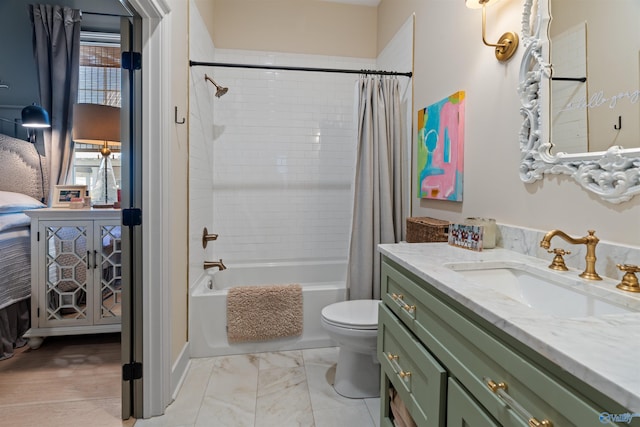 full bathroom featuring shower / bath combo, toilet, and vanity