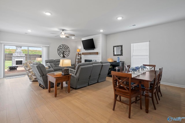 302 Shangrila Way, Meridianville, AL 35759 - dining space featuring a fireplace, ceiling fan, light wood finished floors, recessed lighting, and baseboards