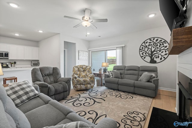 302 Shangrila Way, Meridianville, AL 35759 - living area featuring light wood-style floors, ceiling fan, recessed lighting, and baseboards
