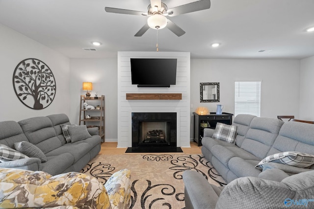 302 Shangrila Way, Meridianville, AL 35759 - living room featuring light wood-style floors, a ceiling fan, a fireplace, and recessed lighting