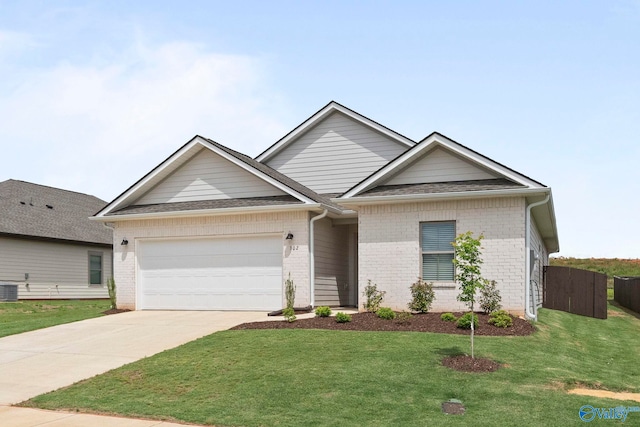 302 Shangrila Way, Meridianville, AL 35759 - view of front of property featuring an attached garage, concrete driveway, brick siding, and central air condition unit