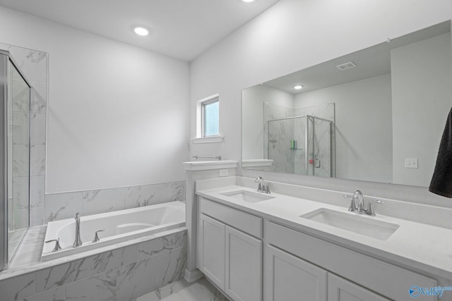 302 Shangrila Way, Meridianville, AL 35759 - full bath featuring marble look tile flooring, a garden tub, a marble finish shower, double vanity, and recessed lighting