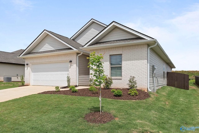 302 Shangrila Way, Meridianville, AL 35759 - view of front of property featuring cooling unit, brick siding, driveway, an attached garage, and a front lawn