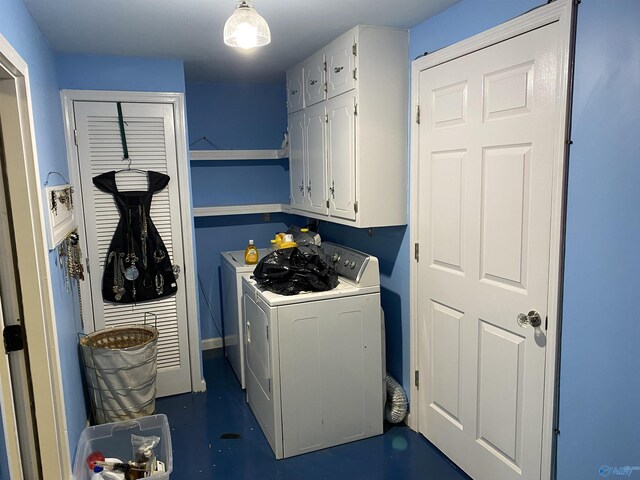 clothes washing area with cabinet space and washer and dryer