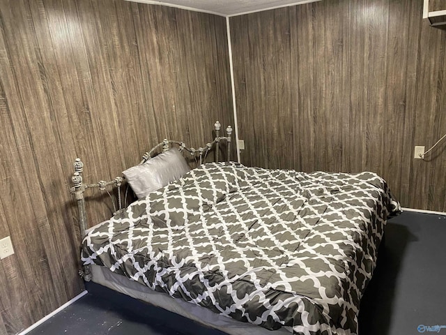bedroom featuring wood walls