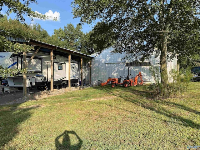 view of yard featuring an outbuilding and an outdoor structure
