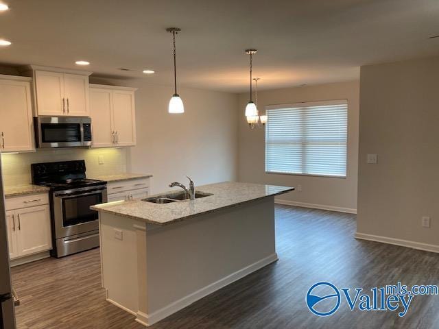 kitchen featuring a sink, white cabinetry, stainless steel appliances, and dark wood-style flooring
