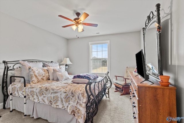 bedroom featuring ceiling fan and light colored carpet