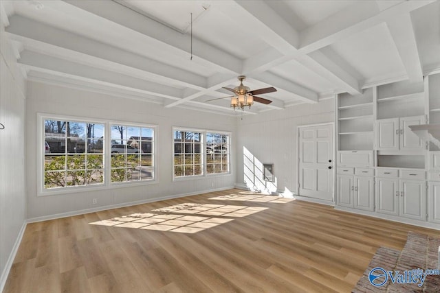 unfurnished living room featuring light wood-type flooring, coffered ceiling, beam ceiling, and baseboards