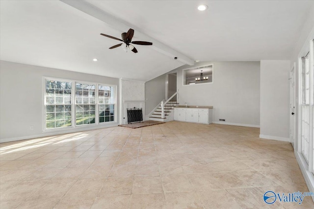 unfurnished living room featuring vaulted ceiling with beams, baseboards, stairway, and ceiling fan